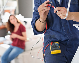 Electrician testing wires