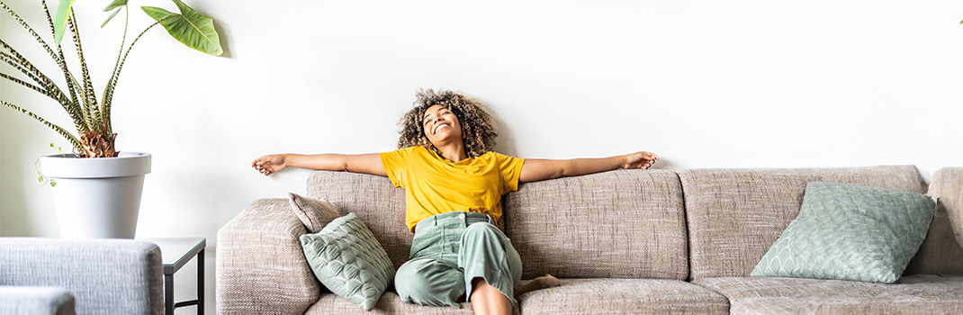 girl laid back on sofa