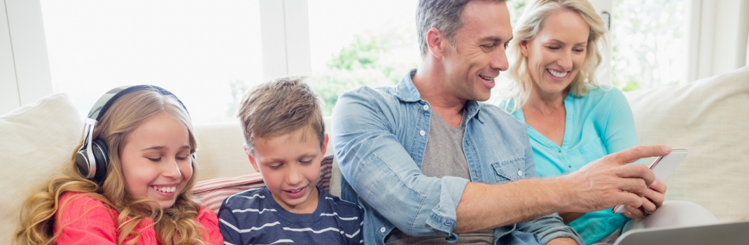 family using electronics devices